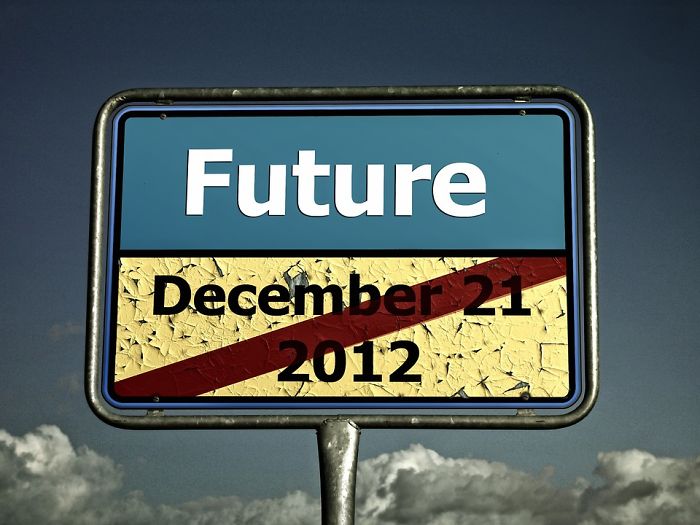 Road sign with c*****d texture showing the word Future and a crossed-out date December 21 2012, symbolizing forgotten trends.