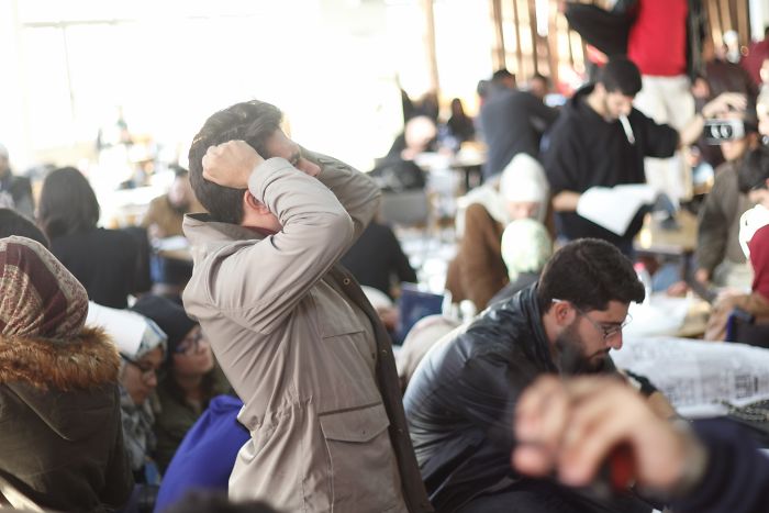 Crowded indoor market scene with people engaged in various activities, illustrating forgotten hottest trends of the past decade.