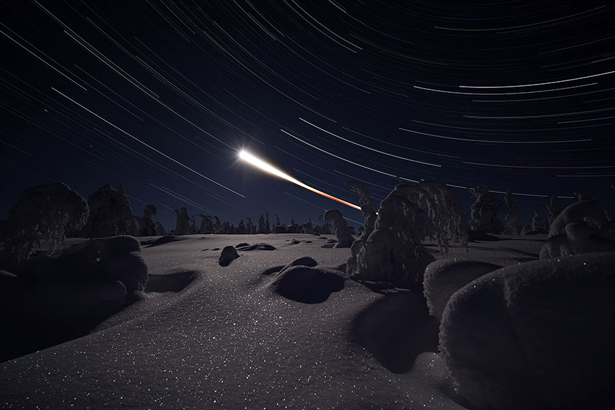 The Sir Patrick Moore Prize For Best Newcomer Joint: 'Eclipsed Moon Trail And Trees Covered With Snow' By Ximeng Deng