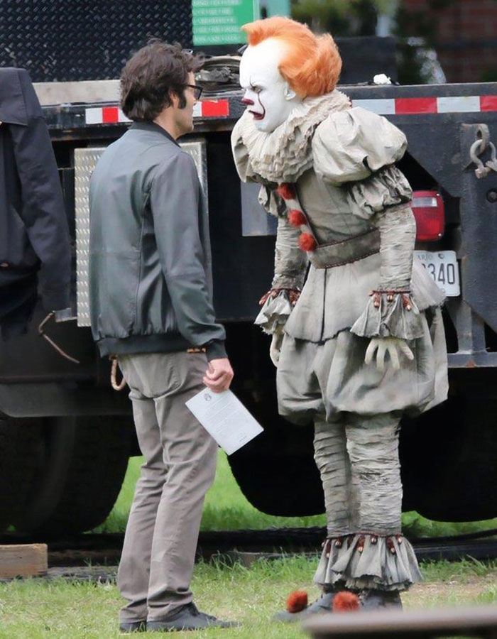 Bill Hader on set with Pennywise, whose crossed eyes shocked him, in a candid behind-the-scenes moment. Bill Hader on set with Pennywise, whose crossed eyes shocked him, in a candid behind-the-scenes moment.