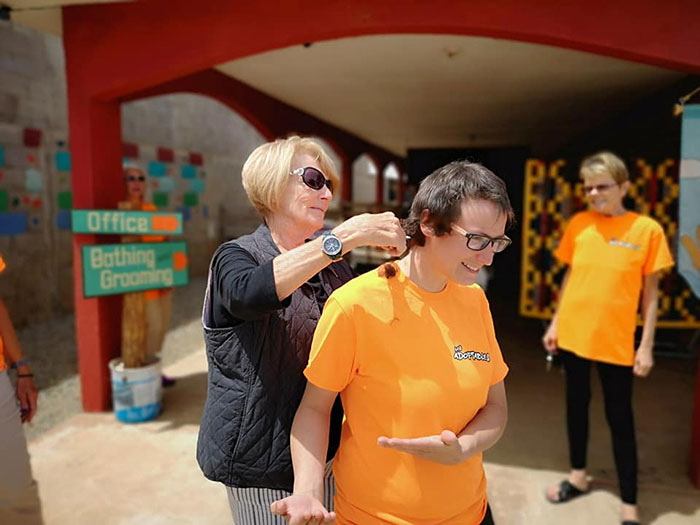 Animal Shelter Employee Asks People To Donate Dog Food For Her Birthday, Builds A Giant Throne Out Of It
