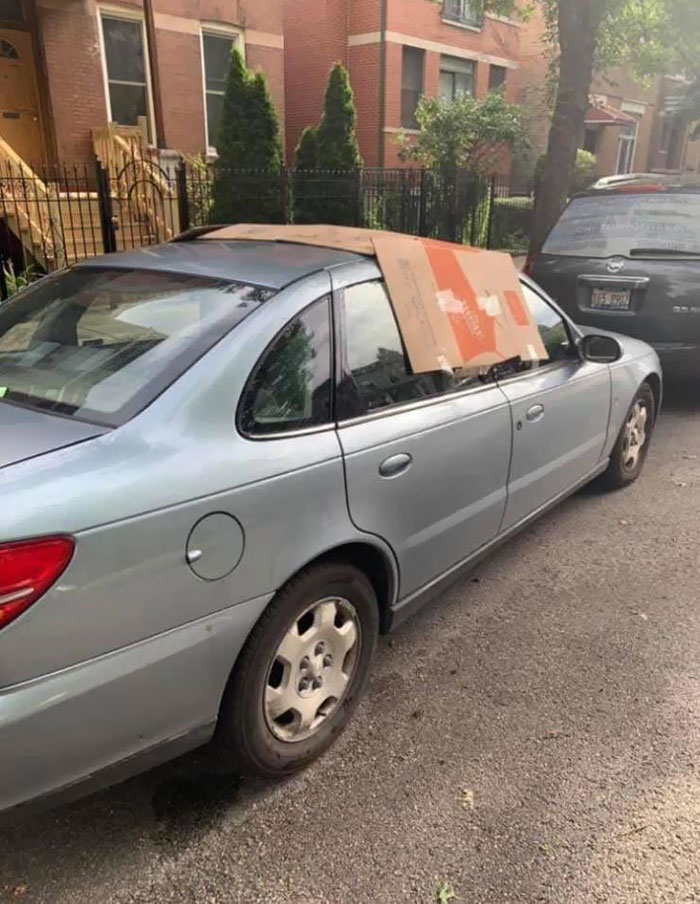 Somebody In The Neighborhood Did This So The Car Won't Get Rained In As The Owner Left The Sunroof Open