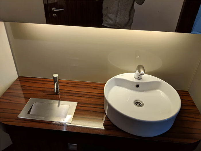 This Soap Dispenser Above The Trash Can In A Local Restaurant