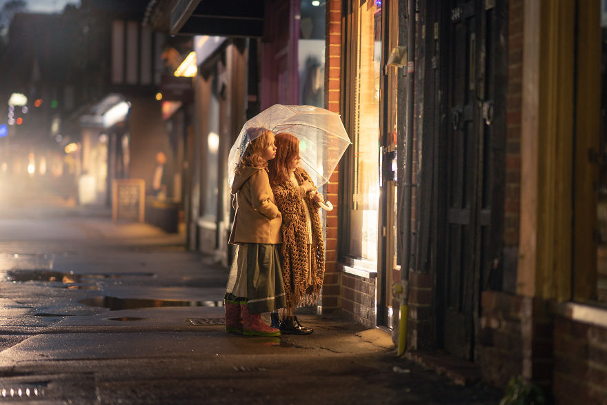 Locksbottom, UK - Girls Looking At A Shop Window In The Rain
