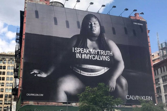 Woman Shames Calvin Klein's Plus-Size Rapper Billboard, She Responds And Starts A Heated Discussion