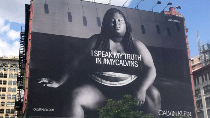 Woman Shames Calvin Klein's Plus-Size Rapper Billboard, She Responds And Starts A Heated Discussion