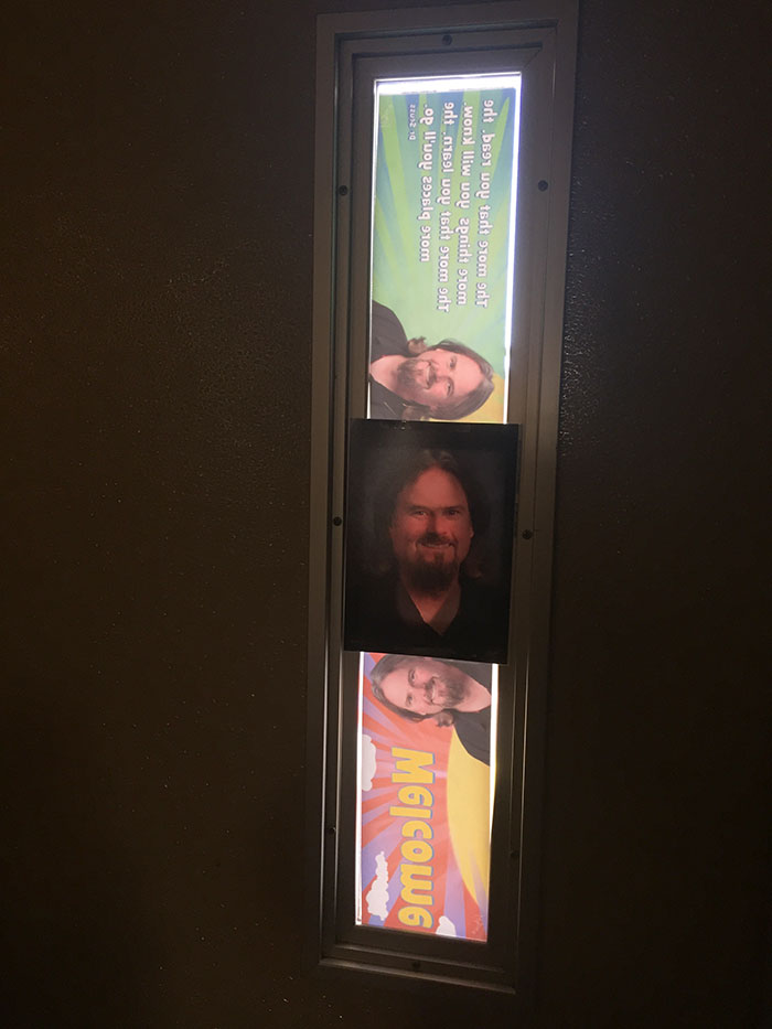 My Economy Teacher Covers Up The Light That Comes Through The Door In The Afternoon With Pictures Of Himself