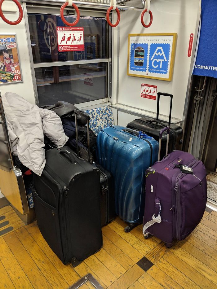 A Family Of Four With All Their Luggages In The Priority Seat And Took Another Whole Row For Themselves While Eating Packed Dinner Inside The Train