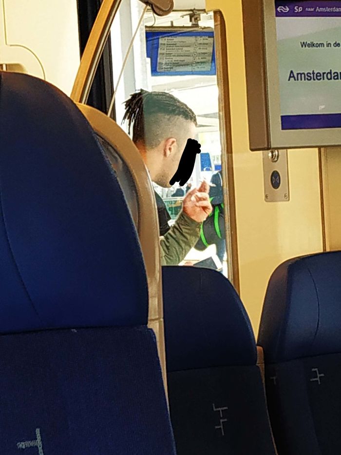 Smoking In The Doorway Of A Train