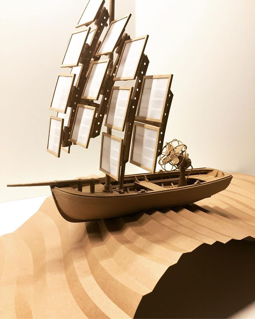 #8 - Now With A Slice Of Ocean, And A Fan For When The Wind Doesn’t Blow. Yes, The Fan Works! A Lot More To Do. #paperart #paperwork #cardboardrobot #paperrobot #robot #robotart #boatbot #cardboardboat