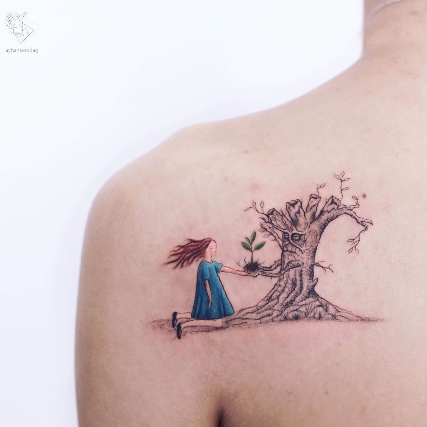 Tattoo design on shoulder; a girl in blue offering a plant to an expressive tree.