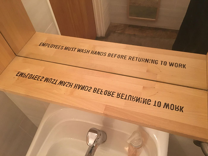 Mirror Frame In Restaurant Bathroom Has A Message In Its Reflection