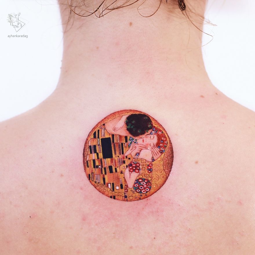 Artistic tattoo design on human skin, featuring a circular, colorful illustration inspired by Gustav Klimt's style.