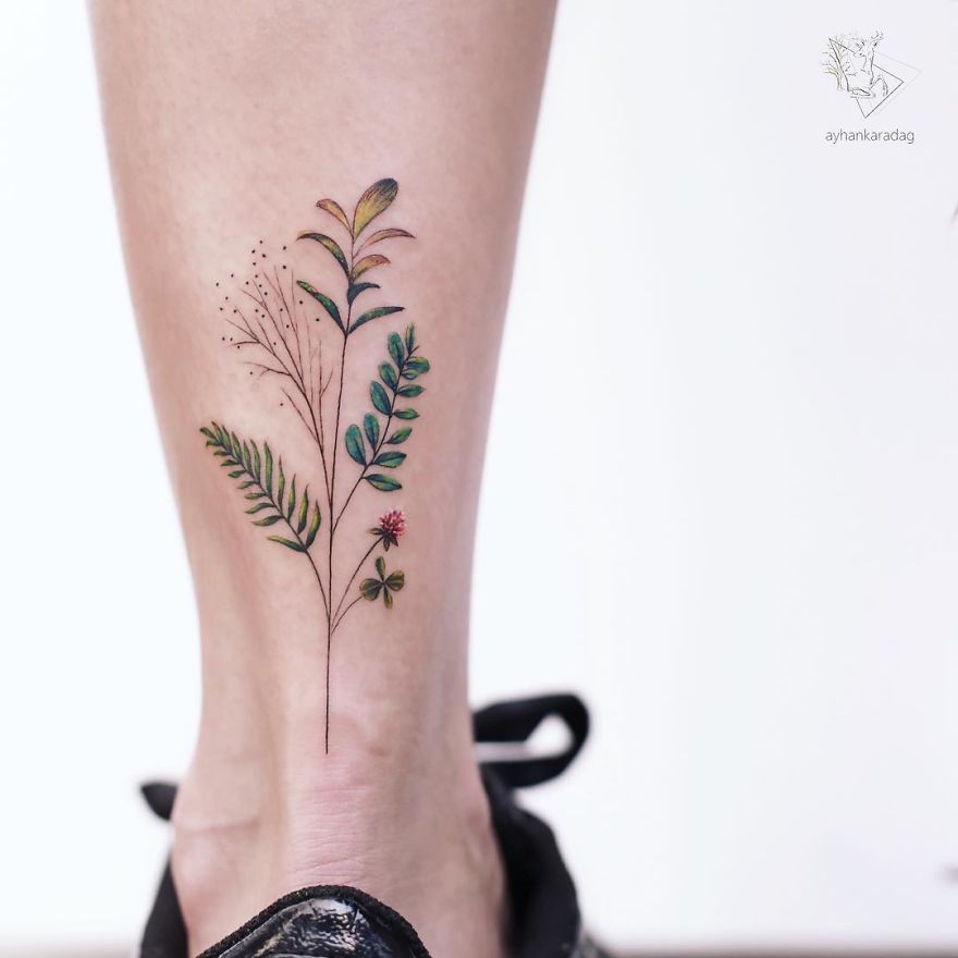 Colorful floral tattoo design on leg, showcasing intricate details on human skin.