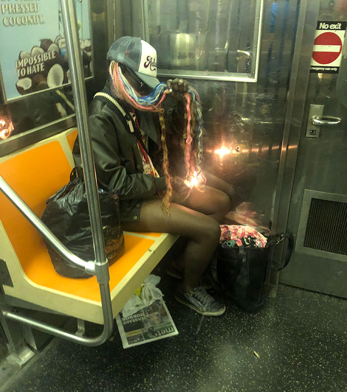 Woman On The Subway Having Fun With Her Hair And A Lighter