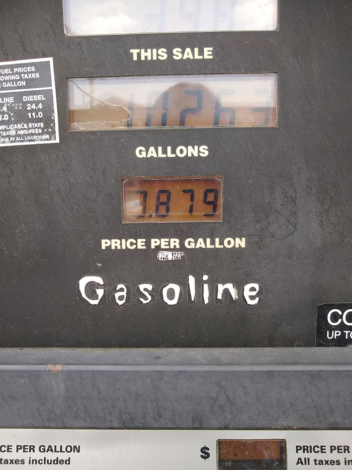 The Way This Gas Sign Has Worn Down Looks Like Spooky Letters