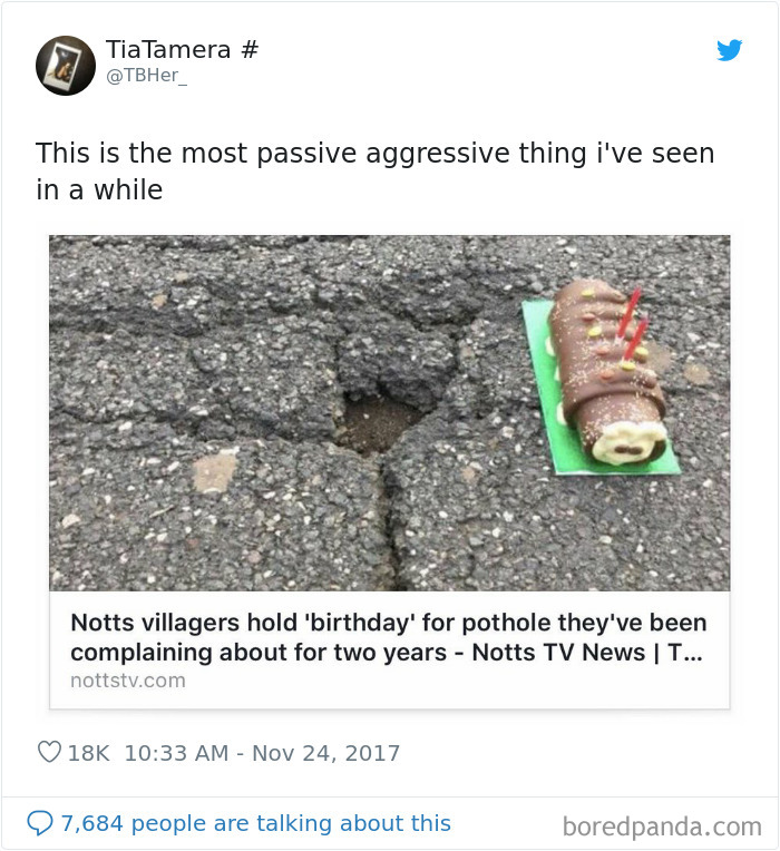 A cake with candles near a small pothole 