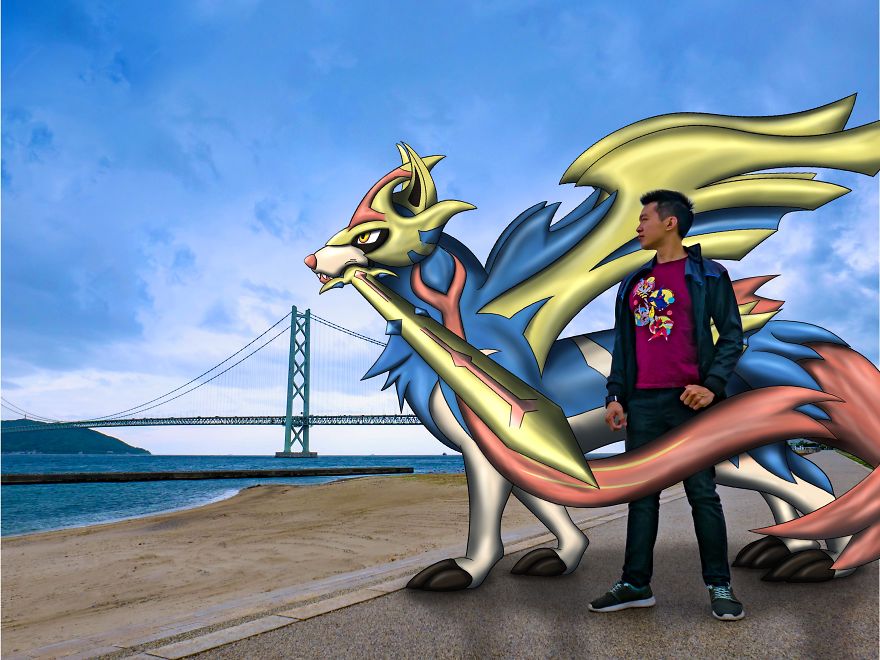 Man standing with a Pokémon illustration near a bridge under a cloudy sky.