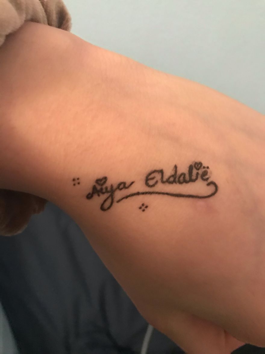 Hand with J. R. R. Tolkien inspired temporary tattoo in Elvish script on wrist.