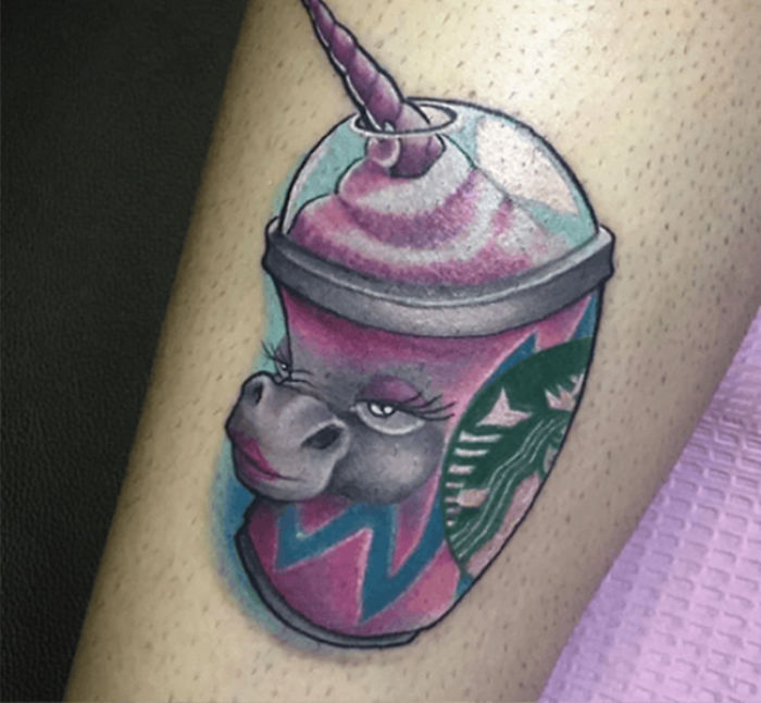Unicorn Starbucks-themed tattoo on a leg.