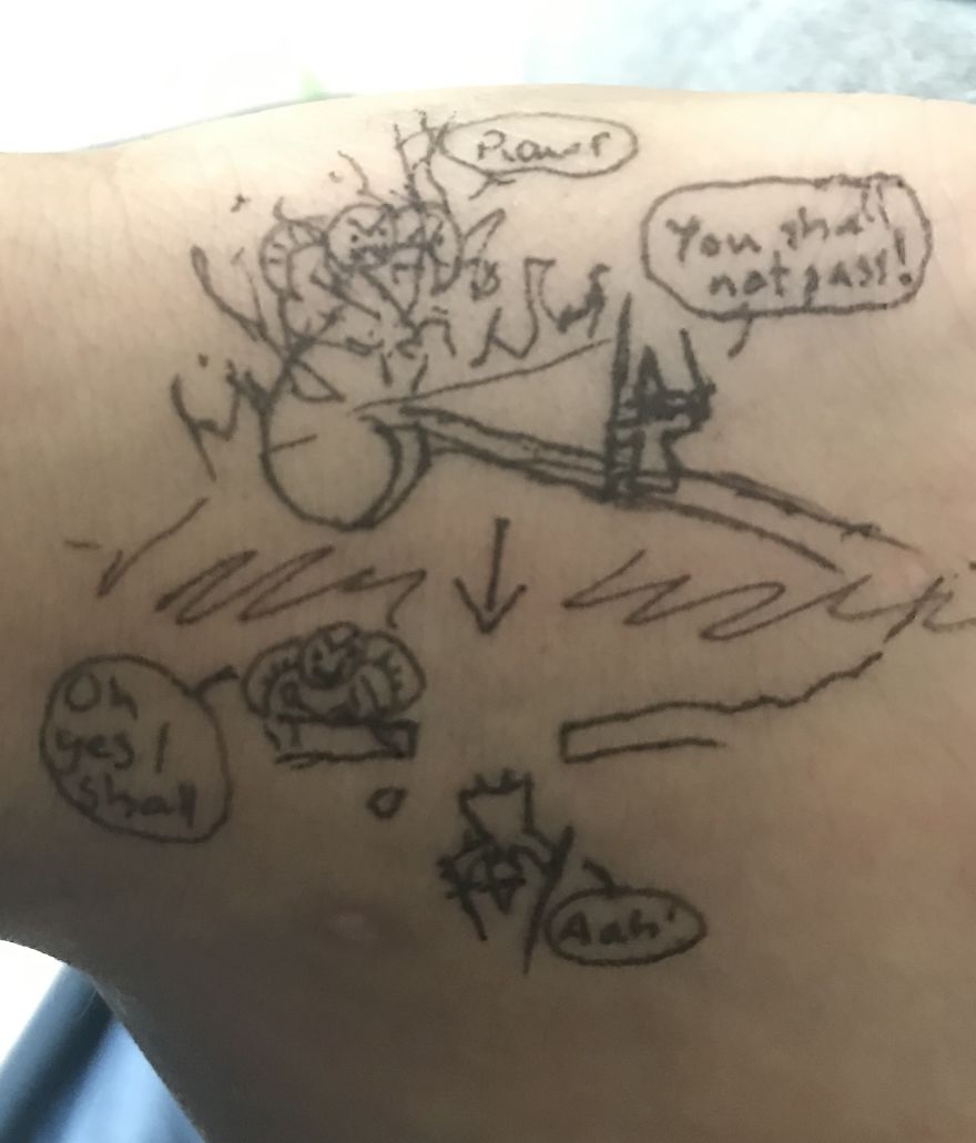 J. R. R. Tolkien inspired doodle with fantasy scenes drawn on skin in black ink.