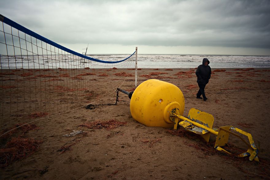 A Local Inspecting The Damage