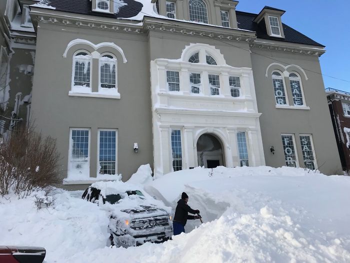 2 Cars. One Cleared. The Other Under The Snow