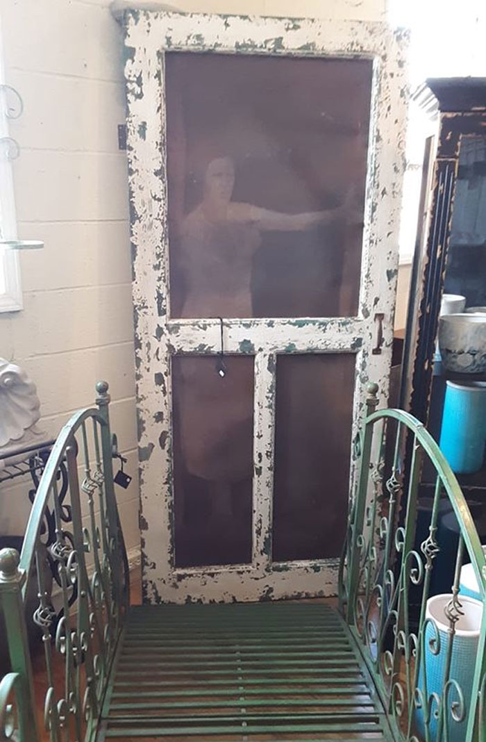 While Thrifting In Madison Georgia Today I Found This Burlap And Screen Double Layered Image Of A Woman Looking Out The Door. It's The Most Stoic Thing I've Encountered So Far.