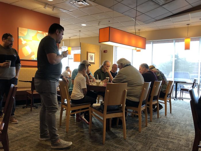 A Kid Was Interested In The Chess Game Unfolding Across At The Table Beside Him, So These Older Bros Invited Him Over To Play