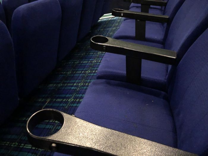 These Cinema Cup Holders With No Bottoms So They Only Fit Their Super Large Drink Cups