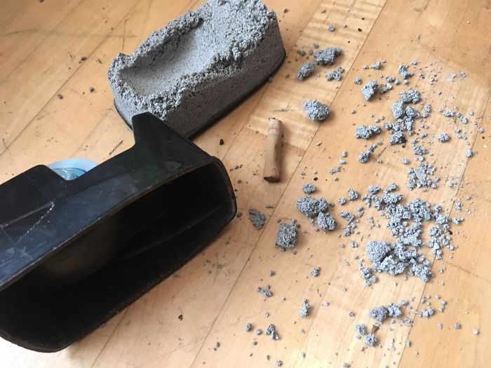 A Cigarette In A Broken Concrete Filled Tape Dispenser