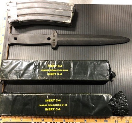 Don’t Over Stuff Your Luggage…especially With An Empty Magazine, Knife, And C4. Our Officer’s May Suspect Fowl Play!