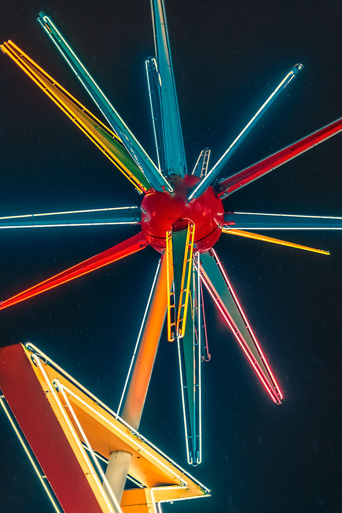 Neon star-shaped sign glowing with vibrant colors against a dark sky in one of the most dangerous cities in America.