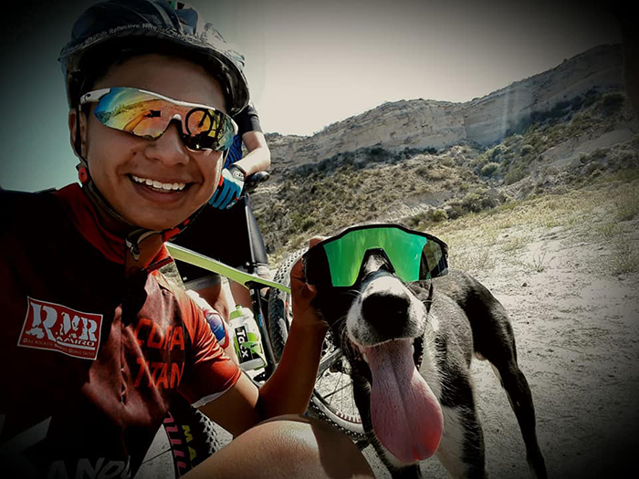 Cyclist Stops Mid-Practice To Help A Dehydrated Dog, Ends Up Carrying It On His Back