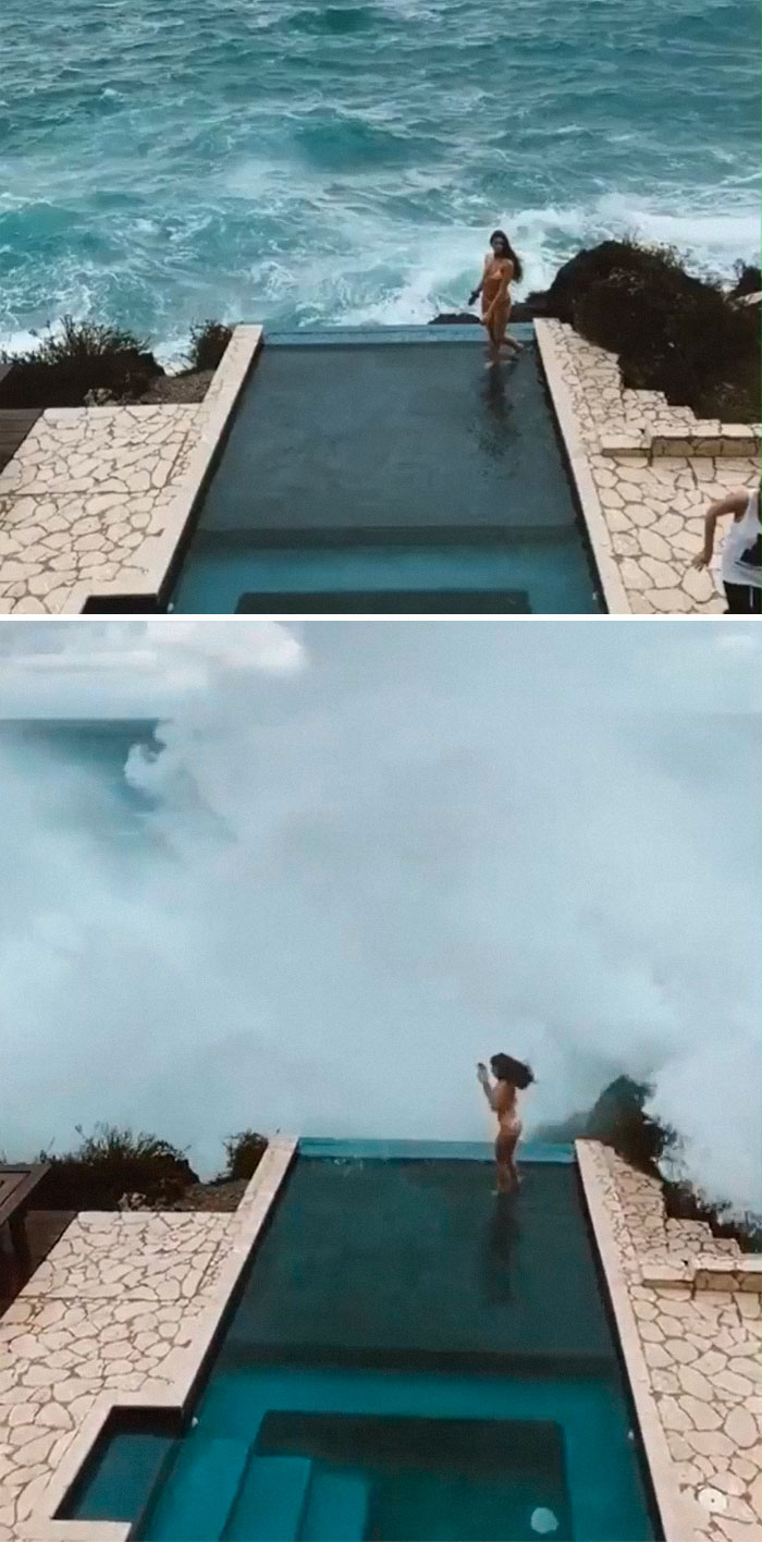 Woman posing in a pool and wave hits the pool 