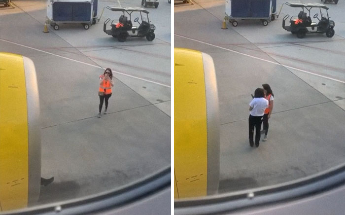 Woman taking a picture of a plane 