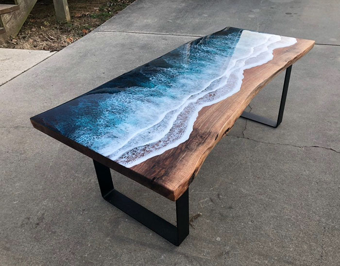 These Artists Create Mesmerizing Tables That Look Like They're Being Washed By An Ocean Wave