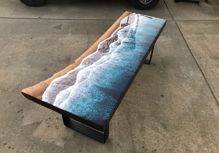 These Artists Create Mesmerizing Tables That Look Like They're Being Washed By An Ocean Wave