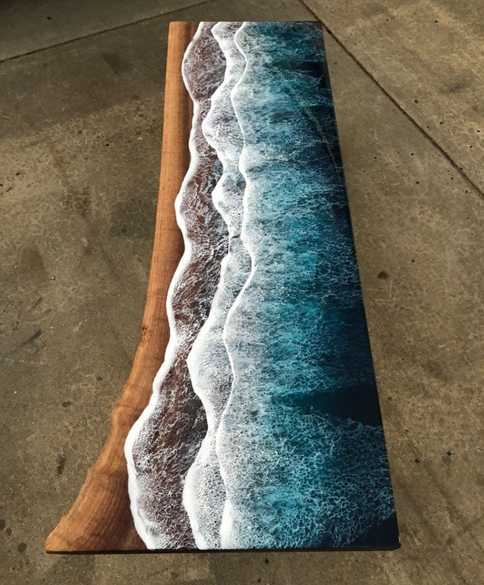 These Artists Create Mesmerizing Tables That Look Like They're Being Washed By An Ocean Wave
