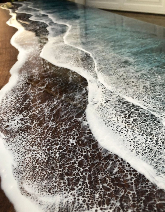 These Artists Create Mesmerizing Tables That Look Like They're Being Washed By An Ocean Wave These Artists Create Mesmerizing Tables That Look Like They're Being Washed By An Ocean Wave
