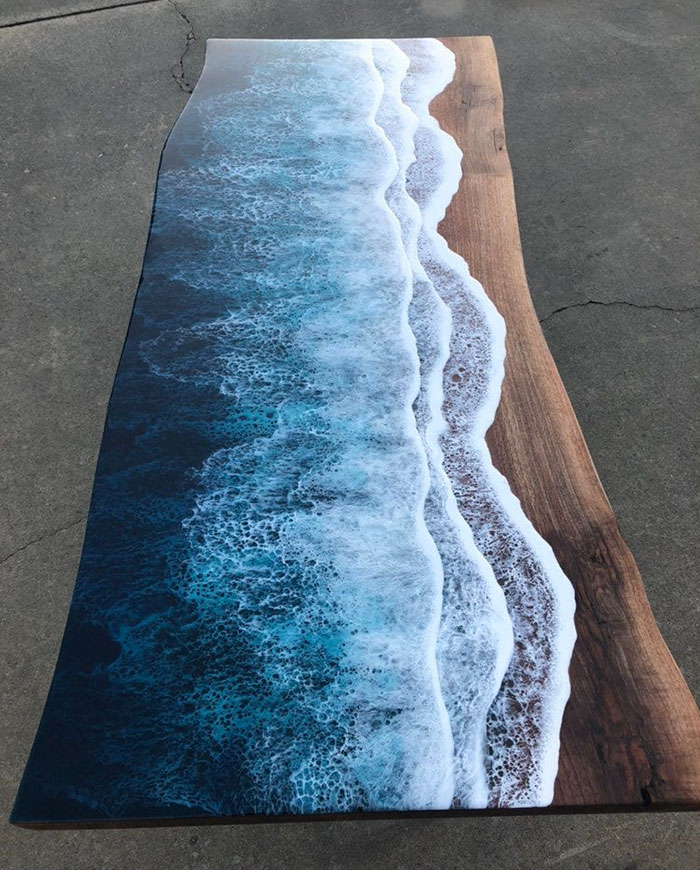 These Artists Create Mesmerizing Tables That Look Like They're Being Washed By An Ocean Wave