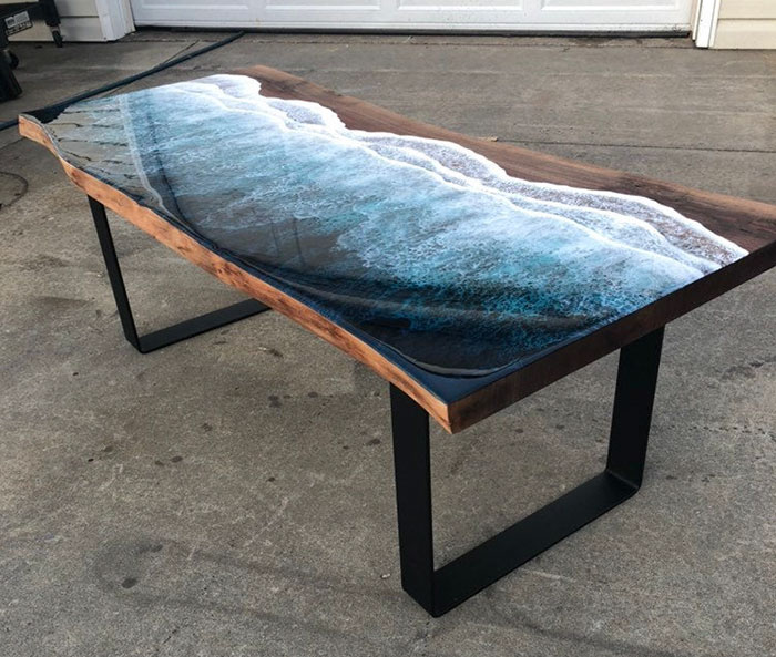 These Artists Create Mesmerizing Tables That Look Like They're Being Washed By An Ocean Wave