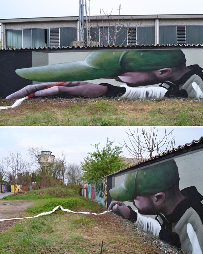 3D street art mural of a man in a green cap interacting with the ground, blending painting with natural surroundings.