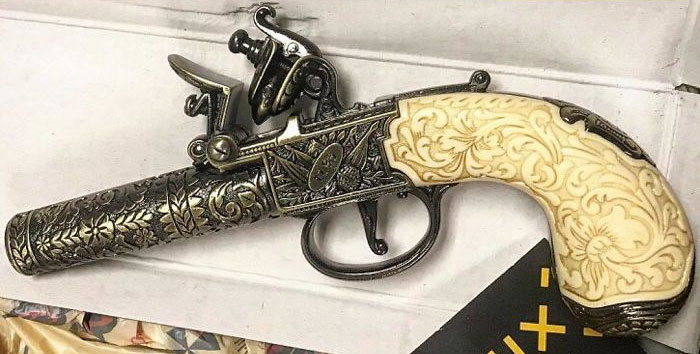 Son O’ A Biscuit Eater! Some Land Lubber ‘N Atlanta Stowed A Flintlock ‘N ‘Is Carry-On Duffle! ‘E Won’ Be Walkin’ Th’ Plank Fer It, But Packin’ A Pistol ‘N Yer Carry-On Can Git Ye Thrown ‘N Th’ Brig ‘N Fined