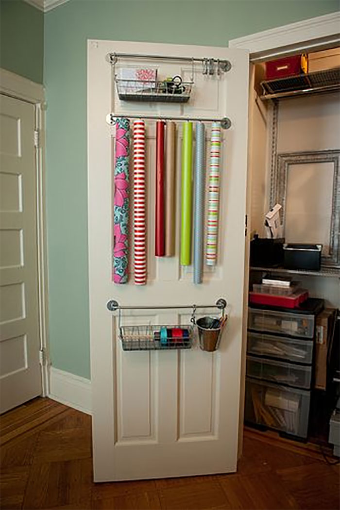 Great Way To Organize Your Wrapping Paper And Get More Storage Is To Hang It Inside Your Doors