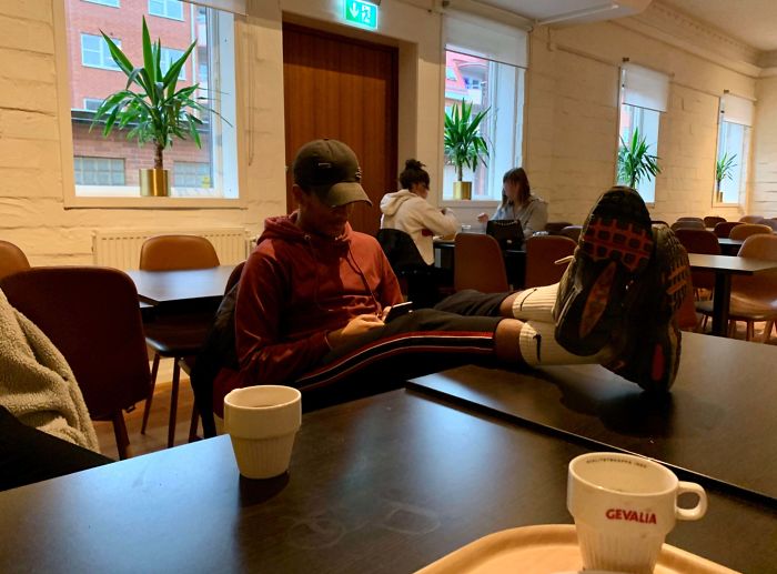 Dude Sitting In Our School's Restaurant With His Feet On The Table