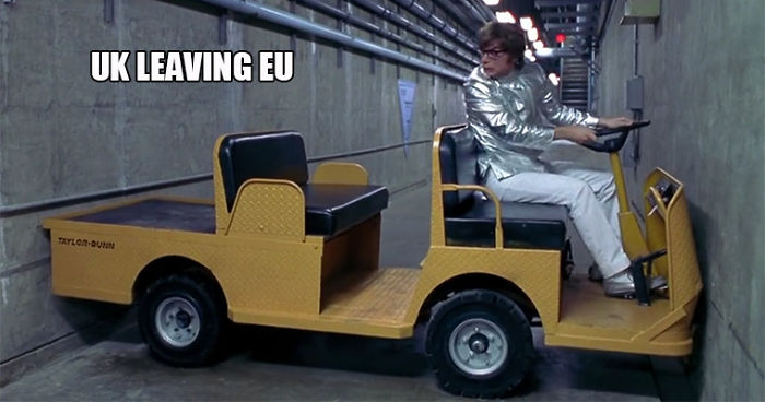 A man in a metallic suit struggles to turn a vehicle in a narrow hallway, captioned "UK leaving EU", representing a funny Brexit meme.