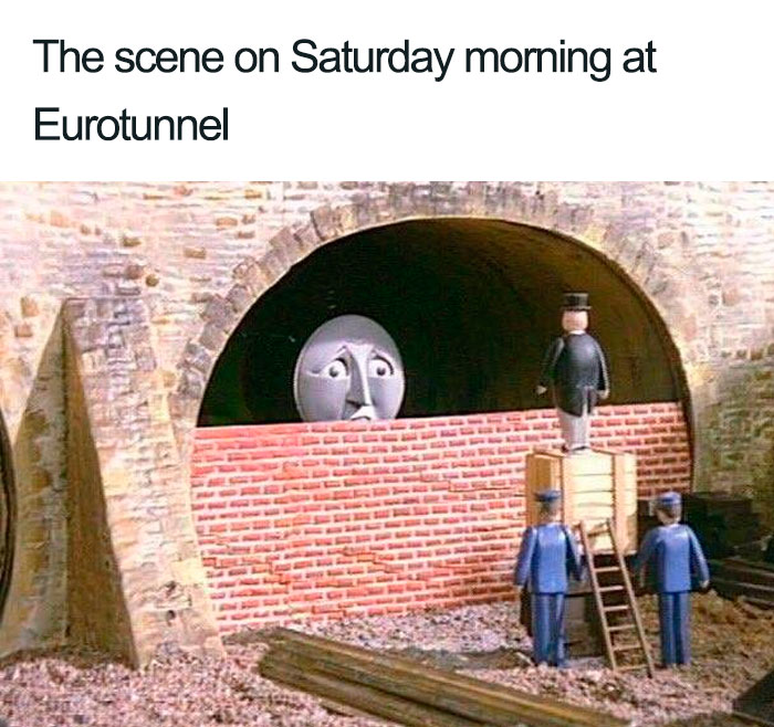 Cartoon train blocked by a brick wall in a tunnel, humorously illustrating Brexit.