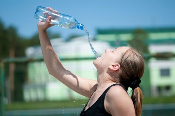 Women-Dont-Know-How-To-Drink-Water-Stock-Photos