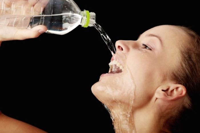 Women-Dont-Know-How-To-Drink-Water-Stock-Photos